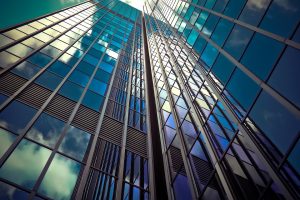 A close up of a skyscraper as seen from below. 