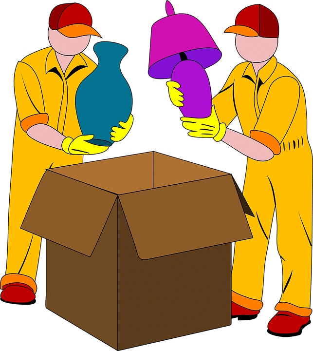 residential moving companies NYC packing items into a box