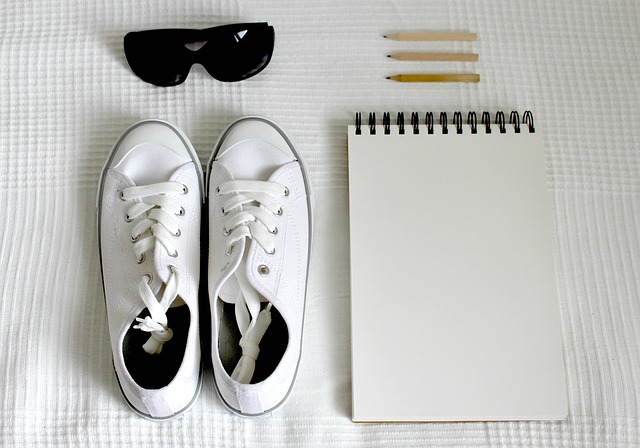 shoes, sunglasses and notepad